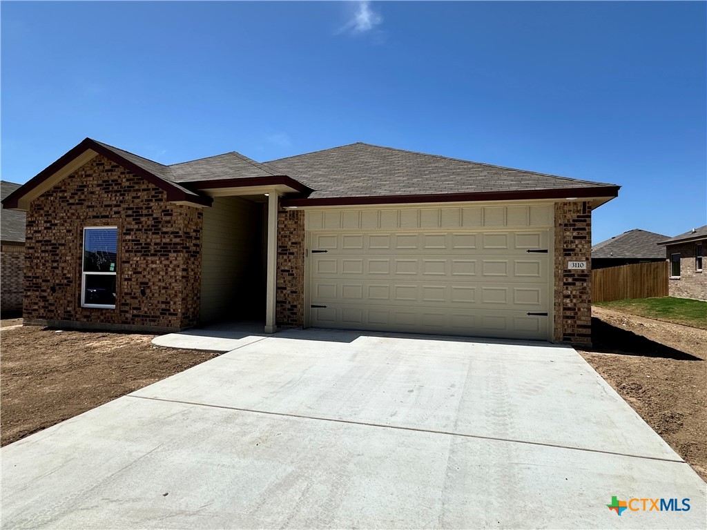 a front view of a house with a garage