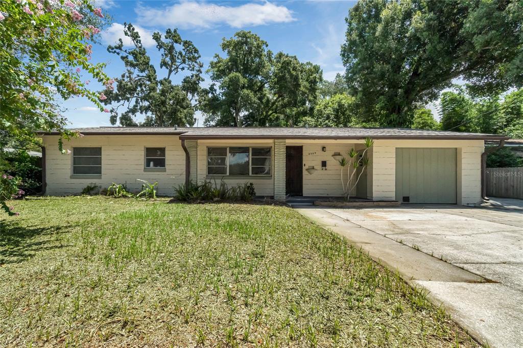 front view of a house with a yard