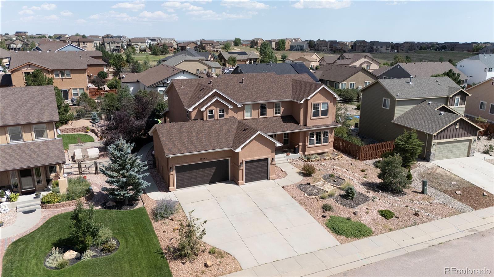 an aerial view of a house with garden