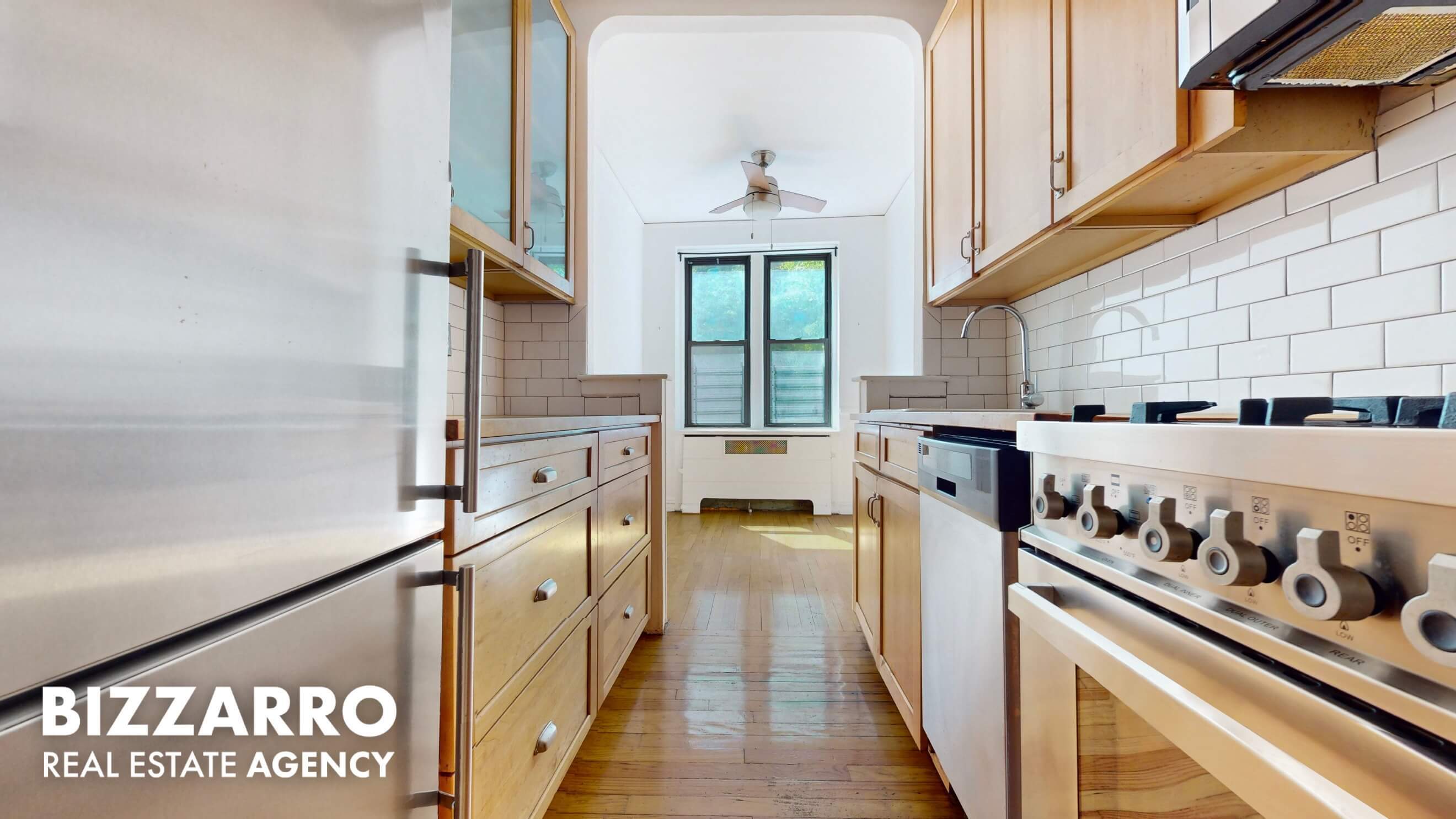 a kitchen with stainless steel appliances granite countertop a stove and a refrigerator