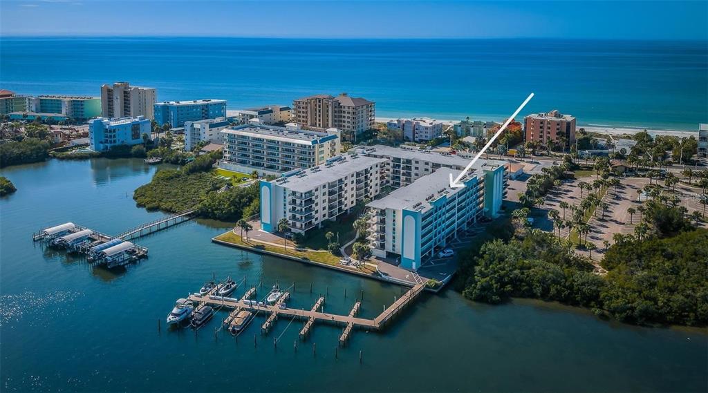 aerial view of a house with a ocean view