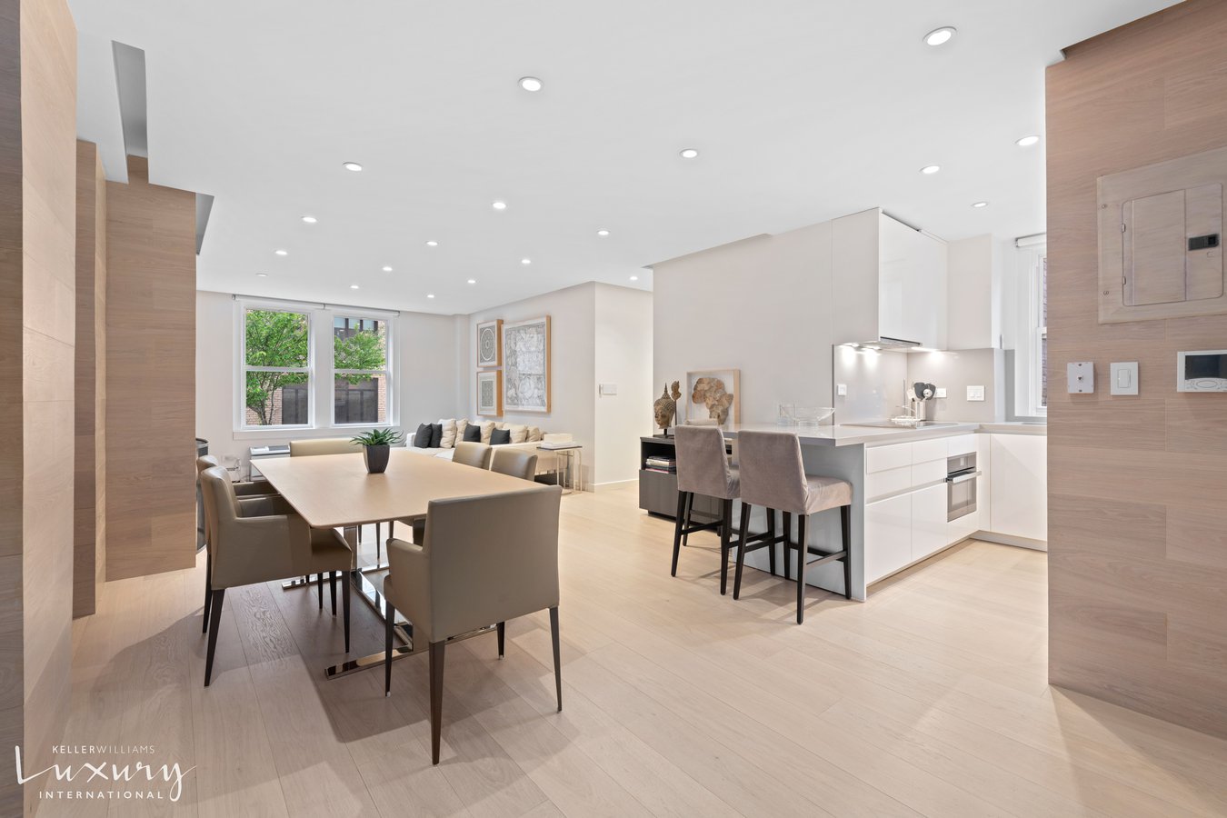 a large kitchen with a table and chairs