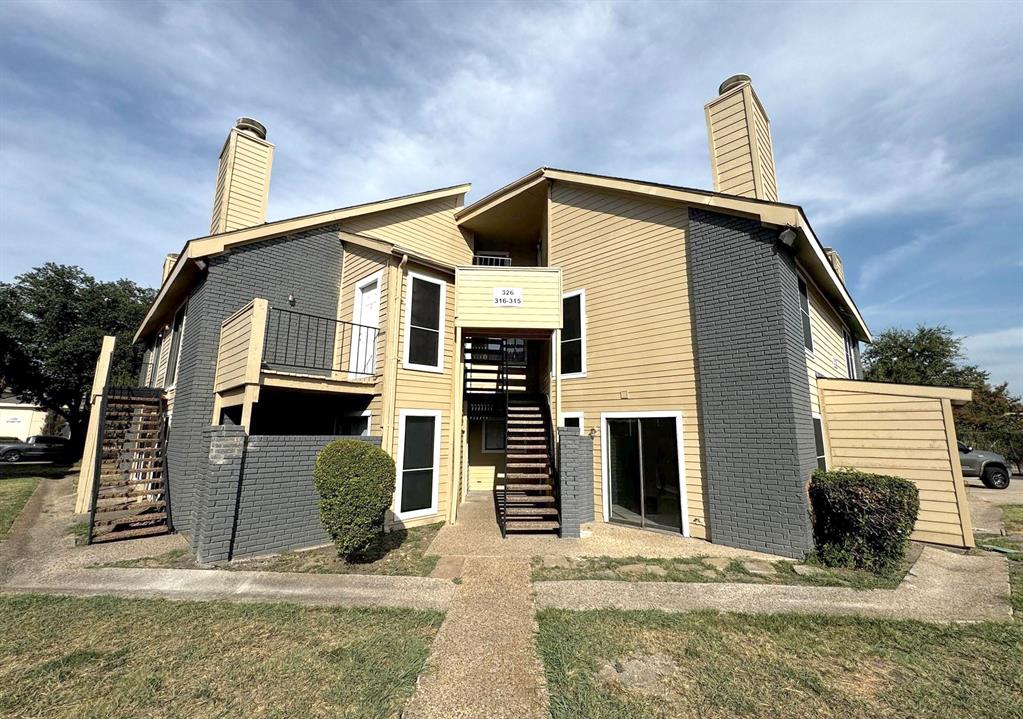 a front view of a house with garage