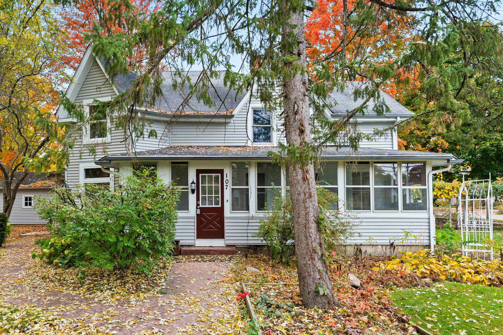 front view of a house with a tree in front