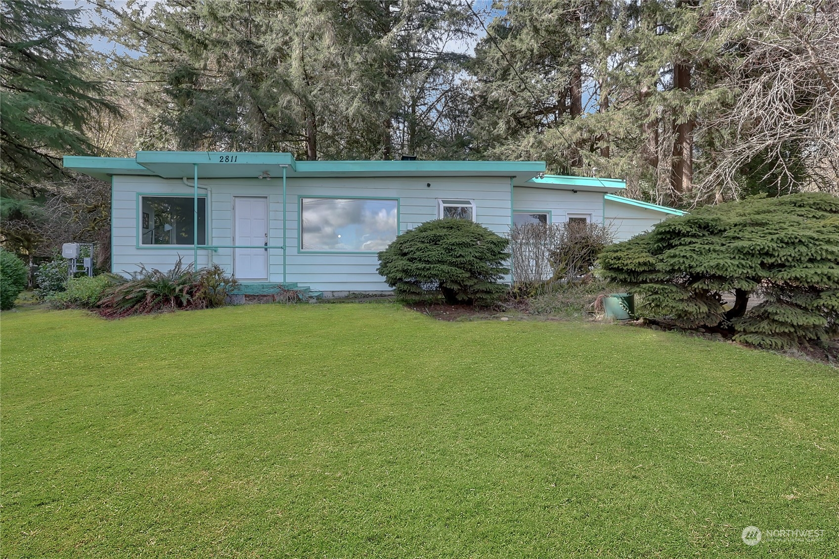 front view of a house with a big yard