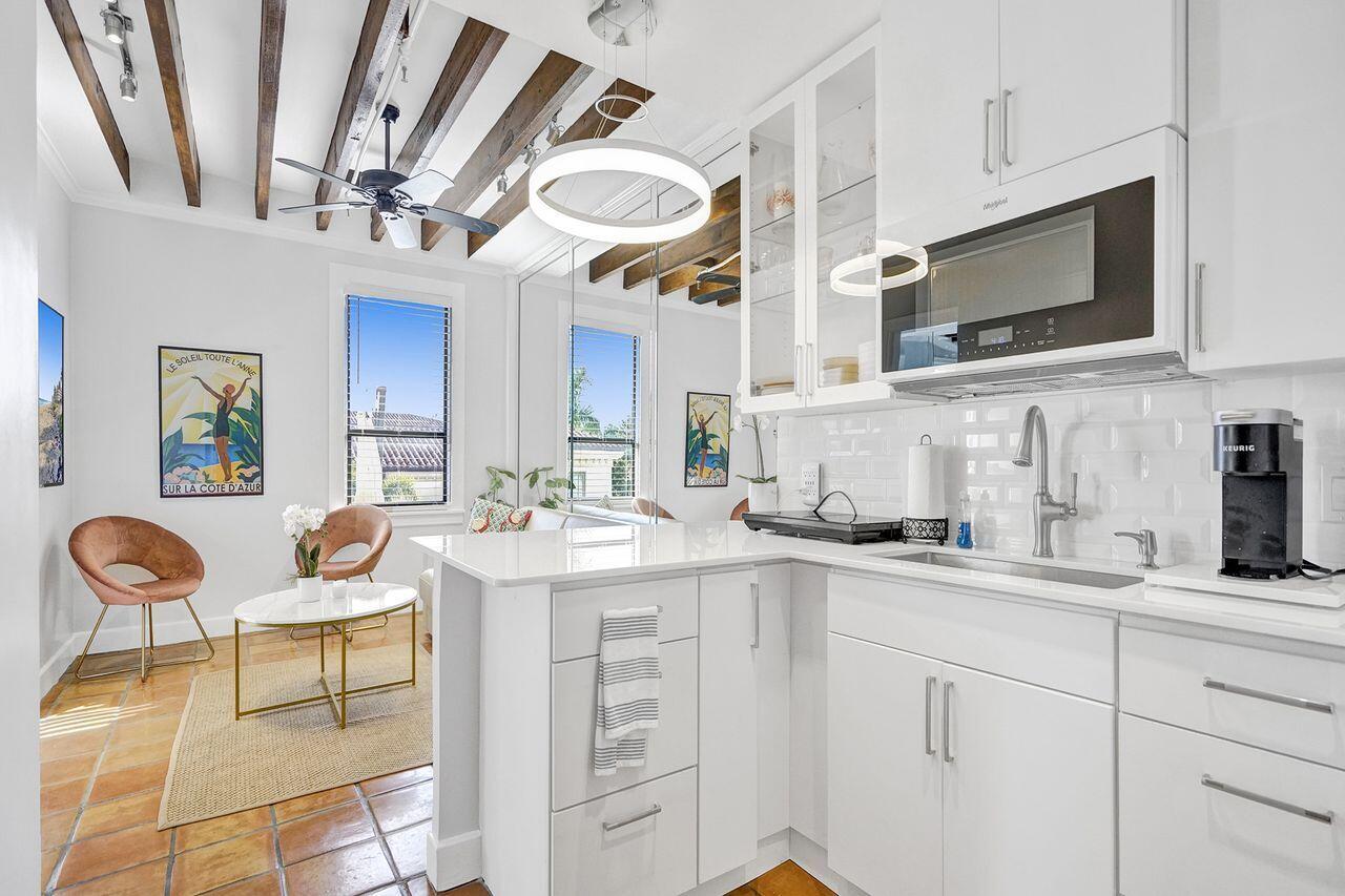 a kitchen with stainless steel appliances granite countertop a sink and cabinets