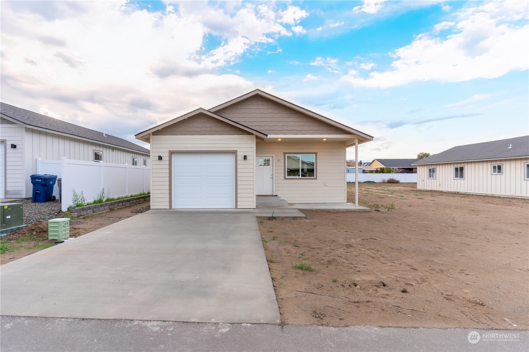 a view of a house with a yard and garage