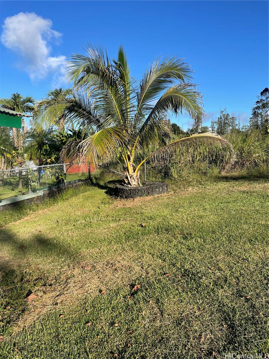 a view of a yard with a house