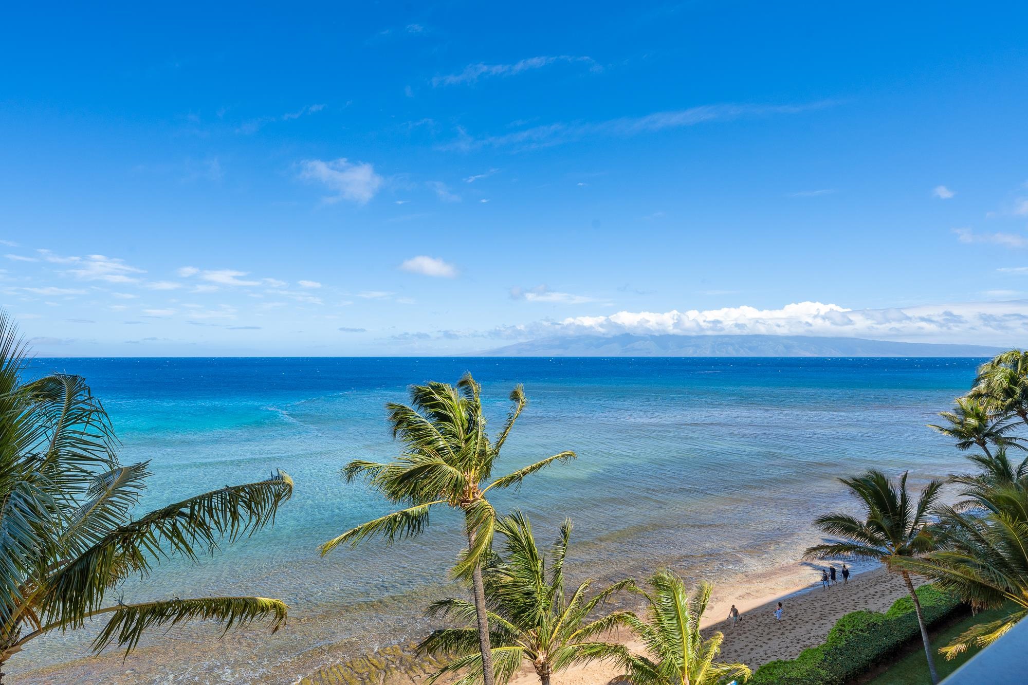 a view of an ocean and beach in the back