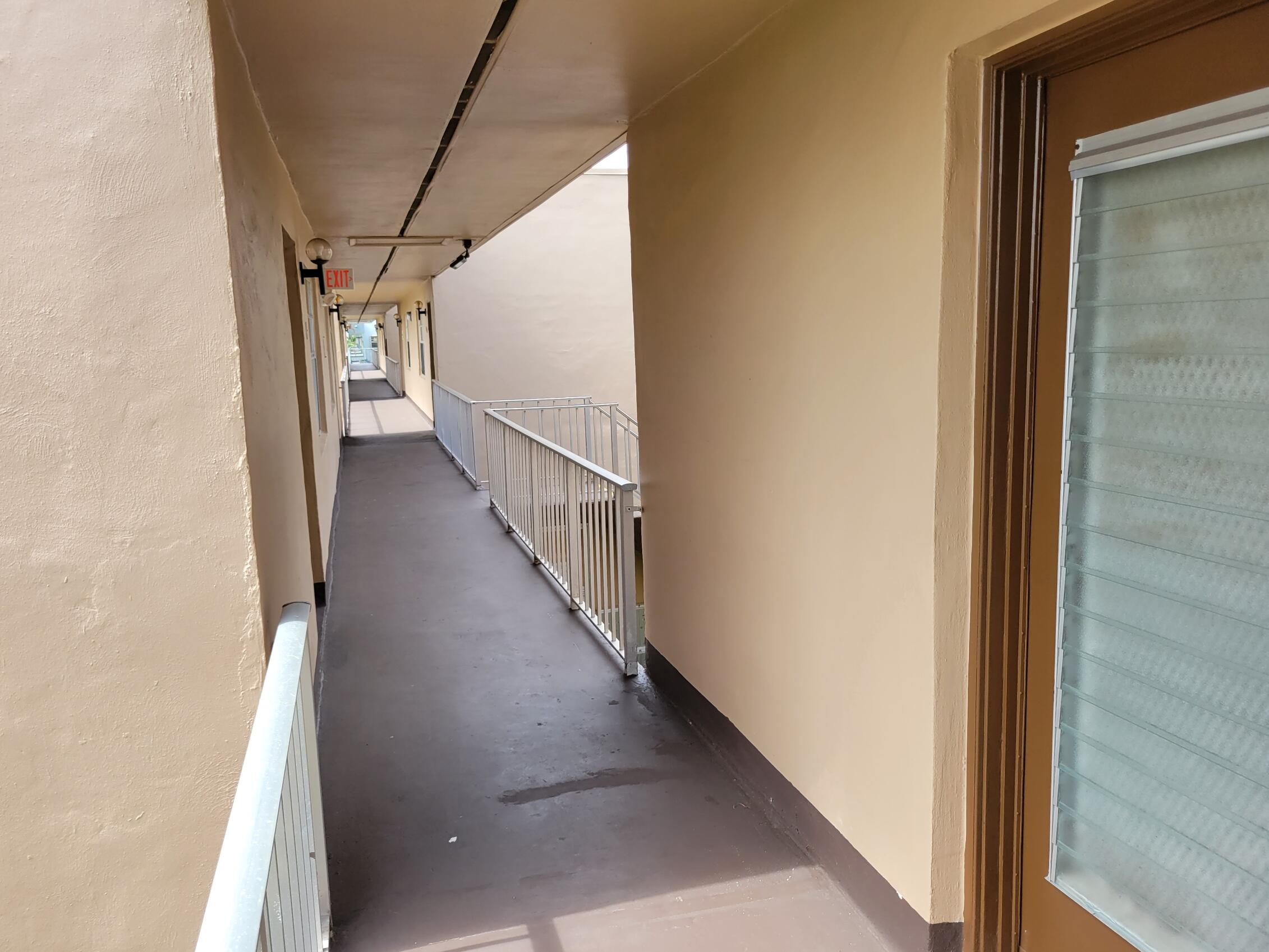 a view of a hallway with stairs