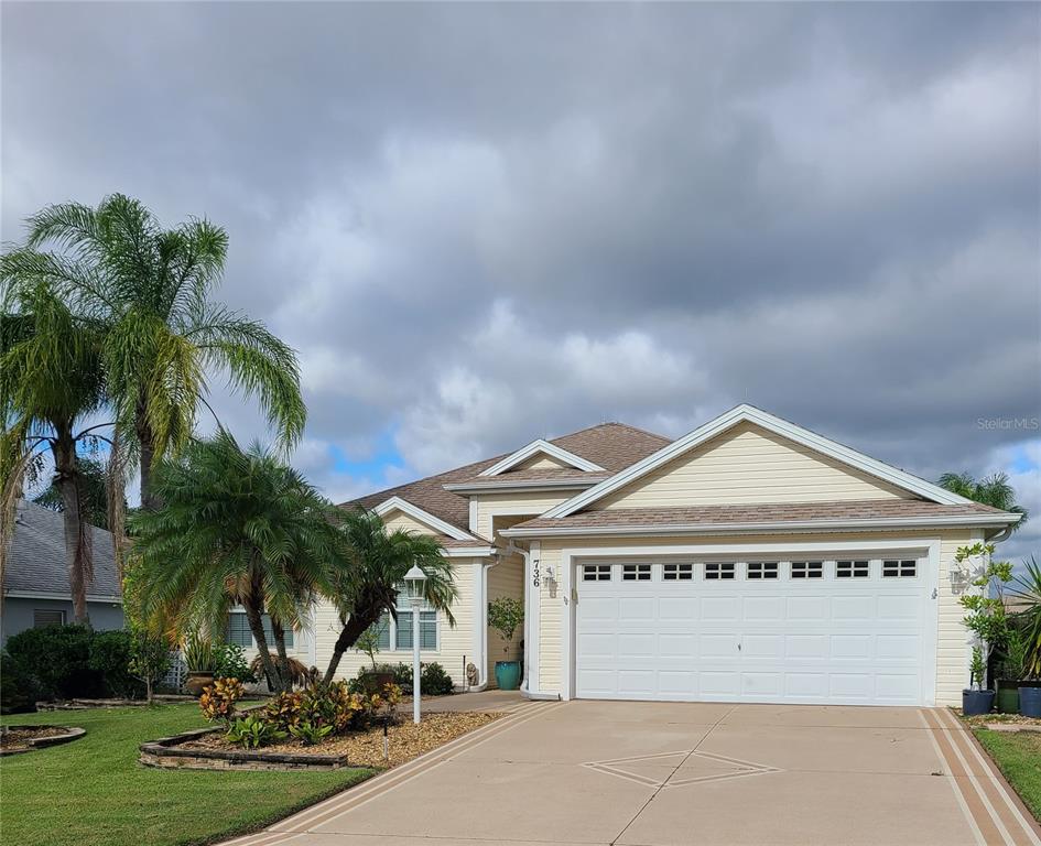 a view of a house with a yard