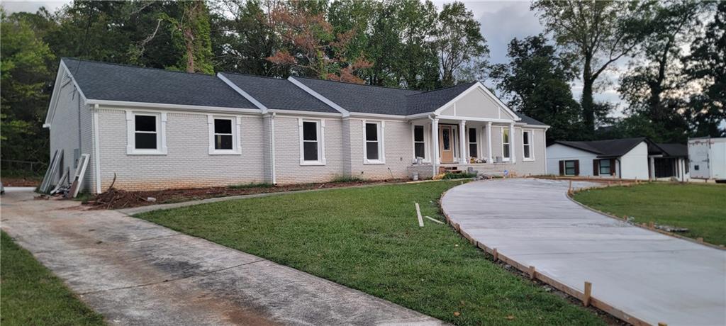 a front view of a house with a yard