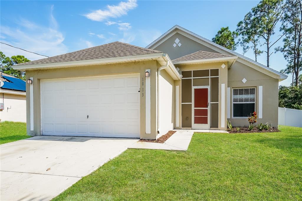 a front view of a house with a yard