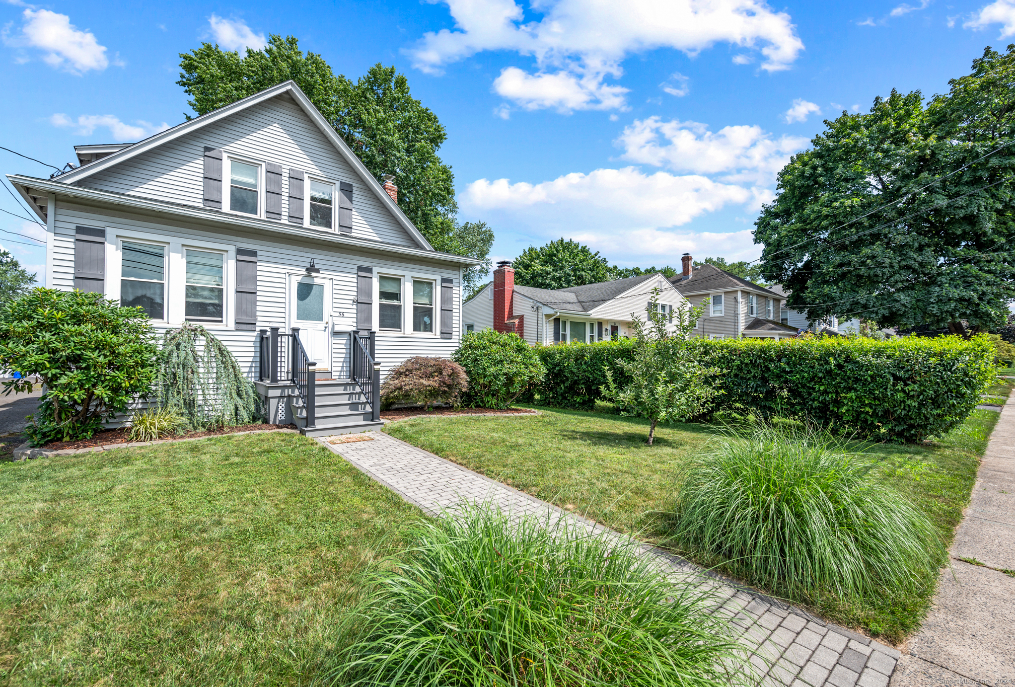 a front view of a house with a yard