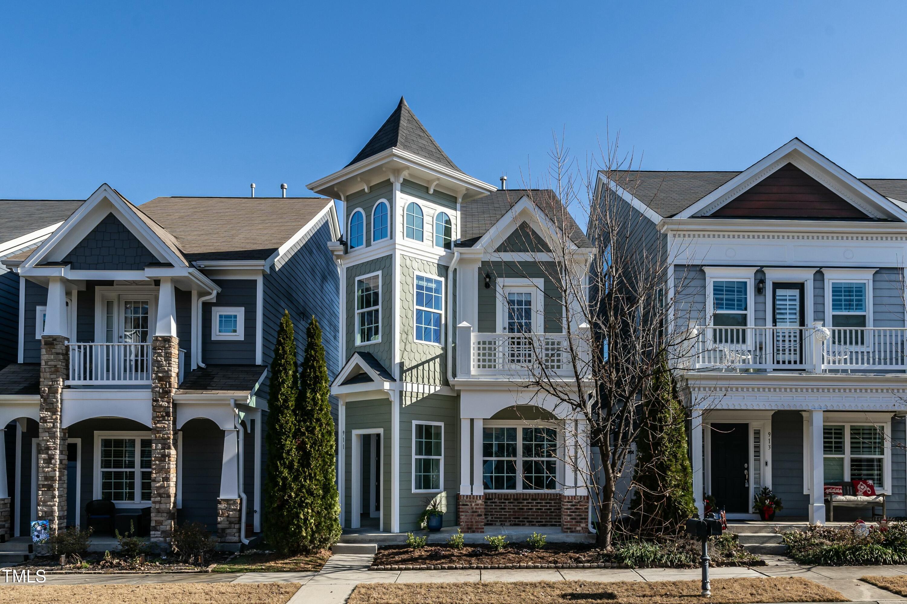 a front view of a residential apartment building with a yard