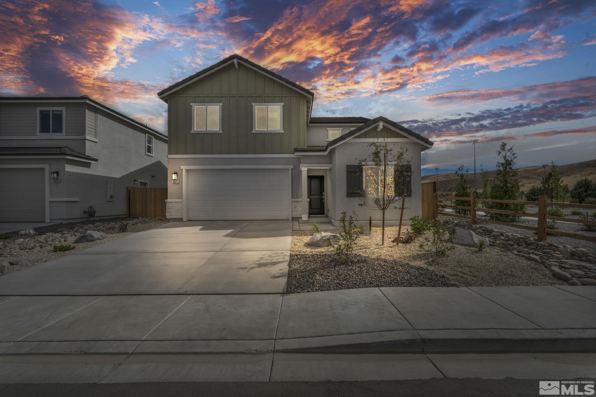 a front view of a house with garage