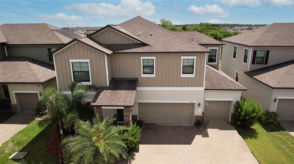 a aerial view of a house with yard and plants