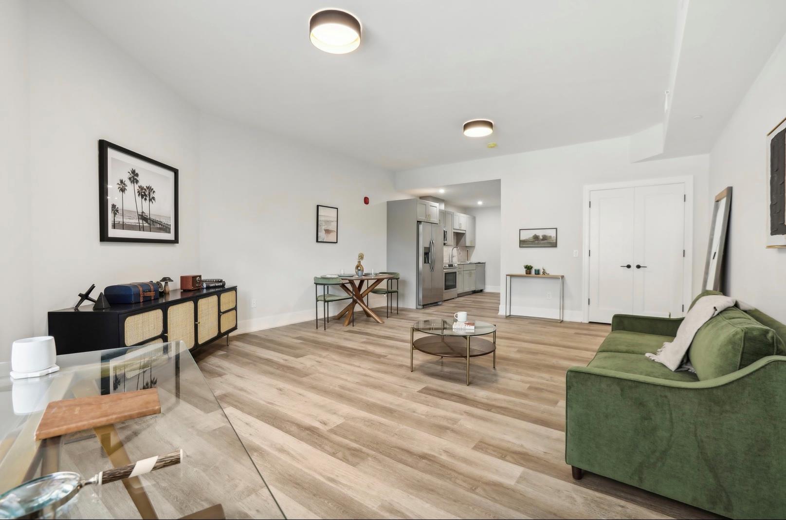 Living room with light hardwood / wood-style flooring