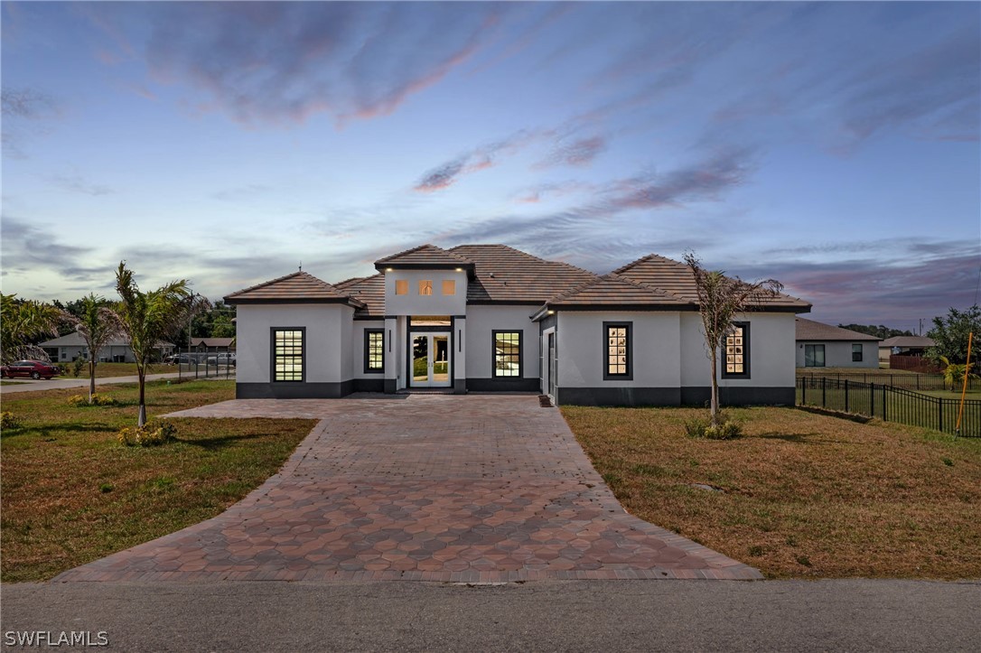 a front view of a house with a yard