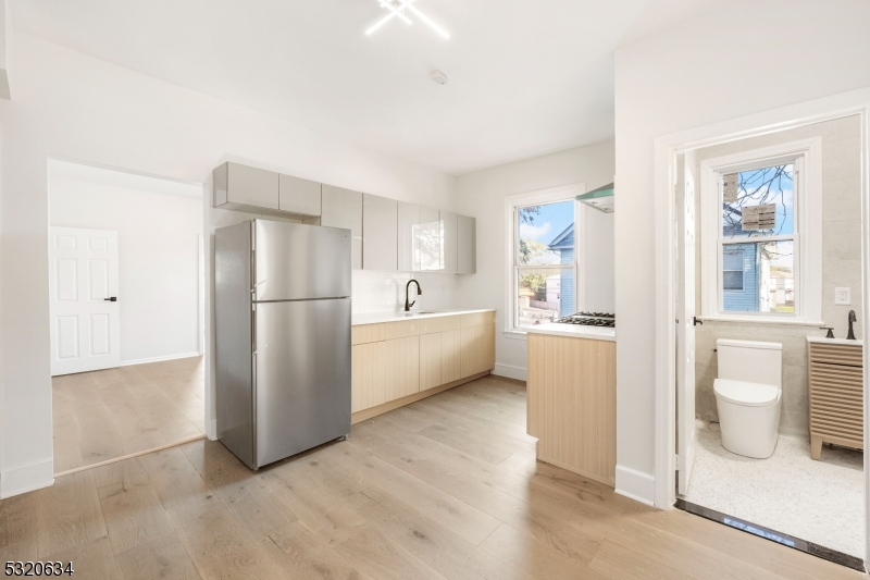 a kitchen with a refrigerator a sink and a dishwasher