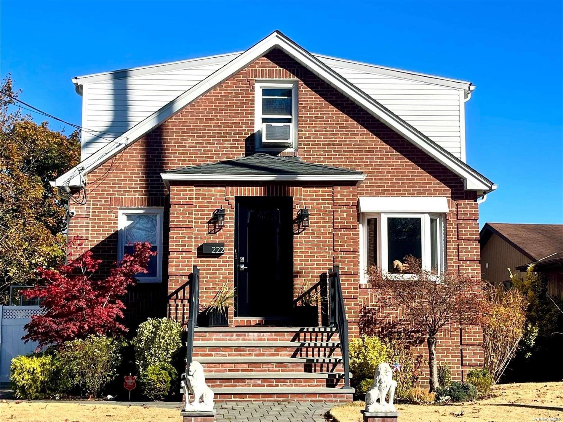 front view of a house with a small yard