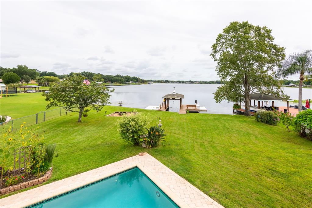 a view of a lake with a big yard