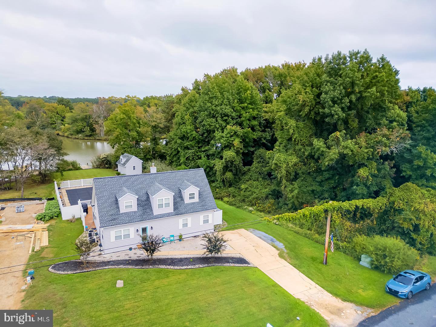 an aerial view of a house with a big yard