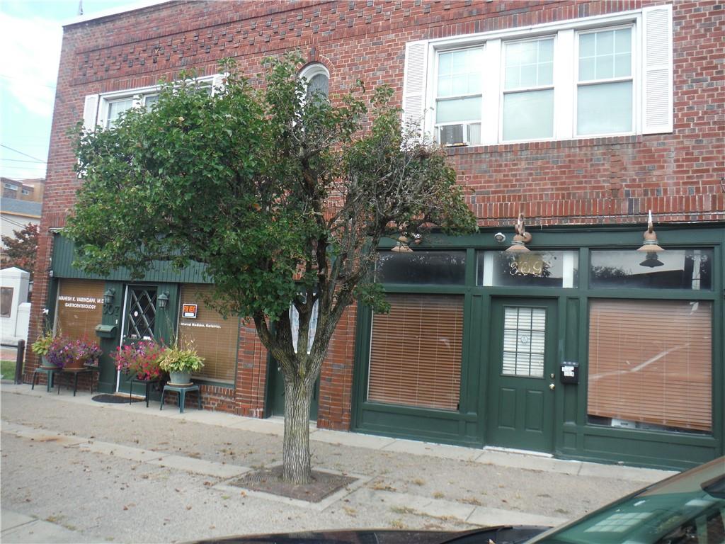 a front view of a house with parking