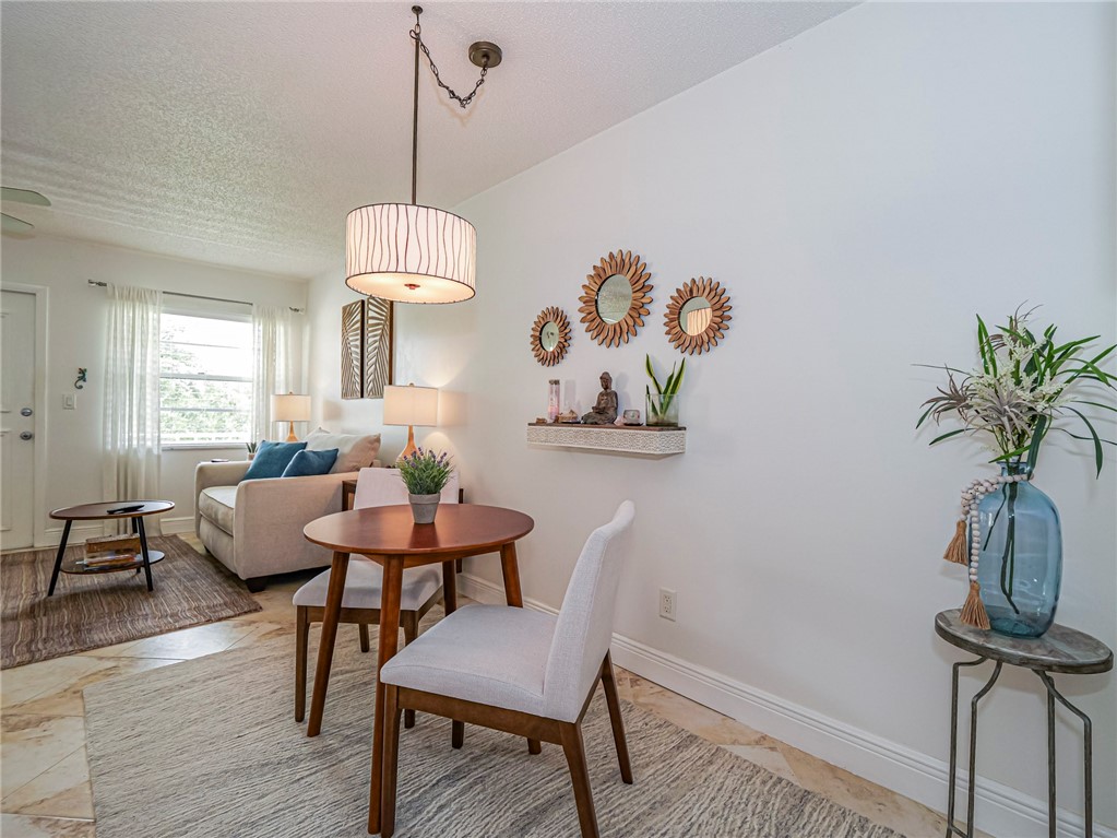 a dining room with furniture and window