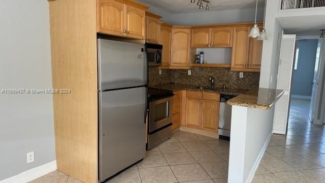 a kitchen with a refrigerator sink and cabinets