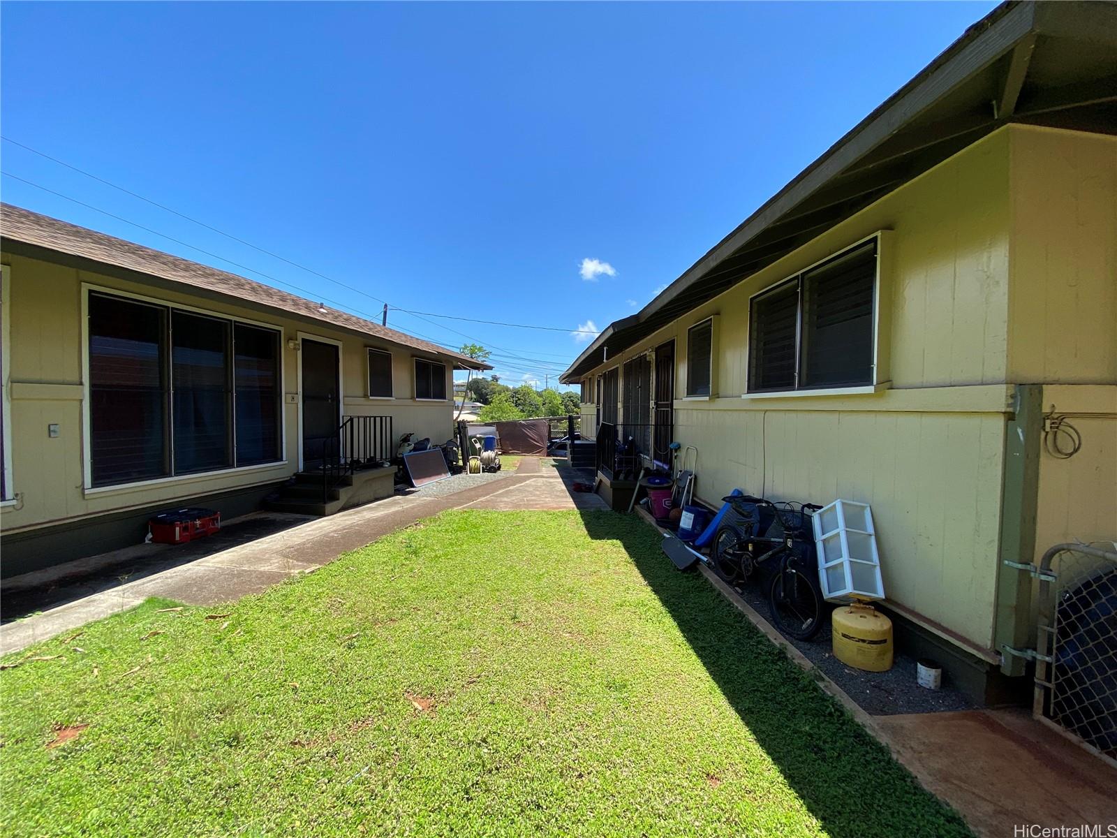 a front view of house and yard with green space