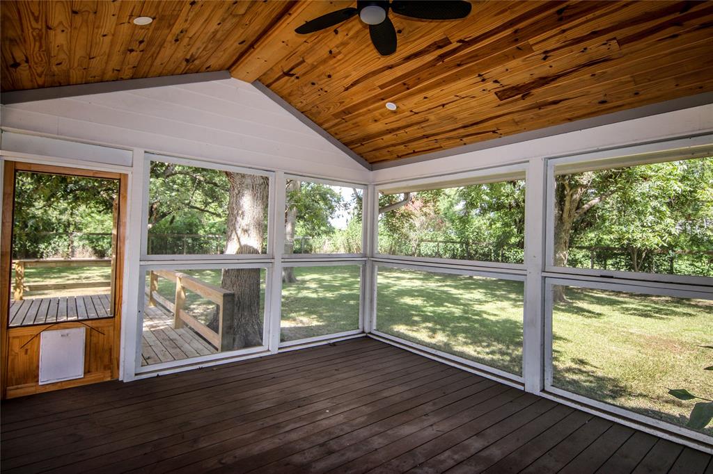 a view of a room with wooden floor and balcony