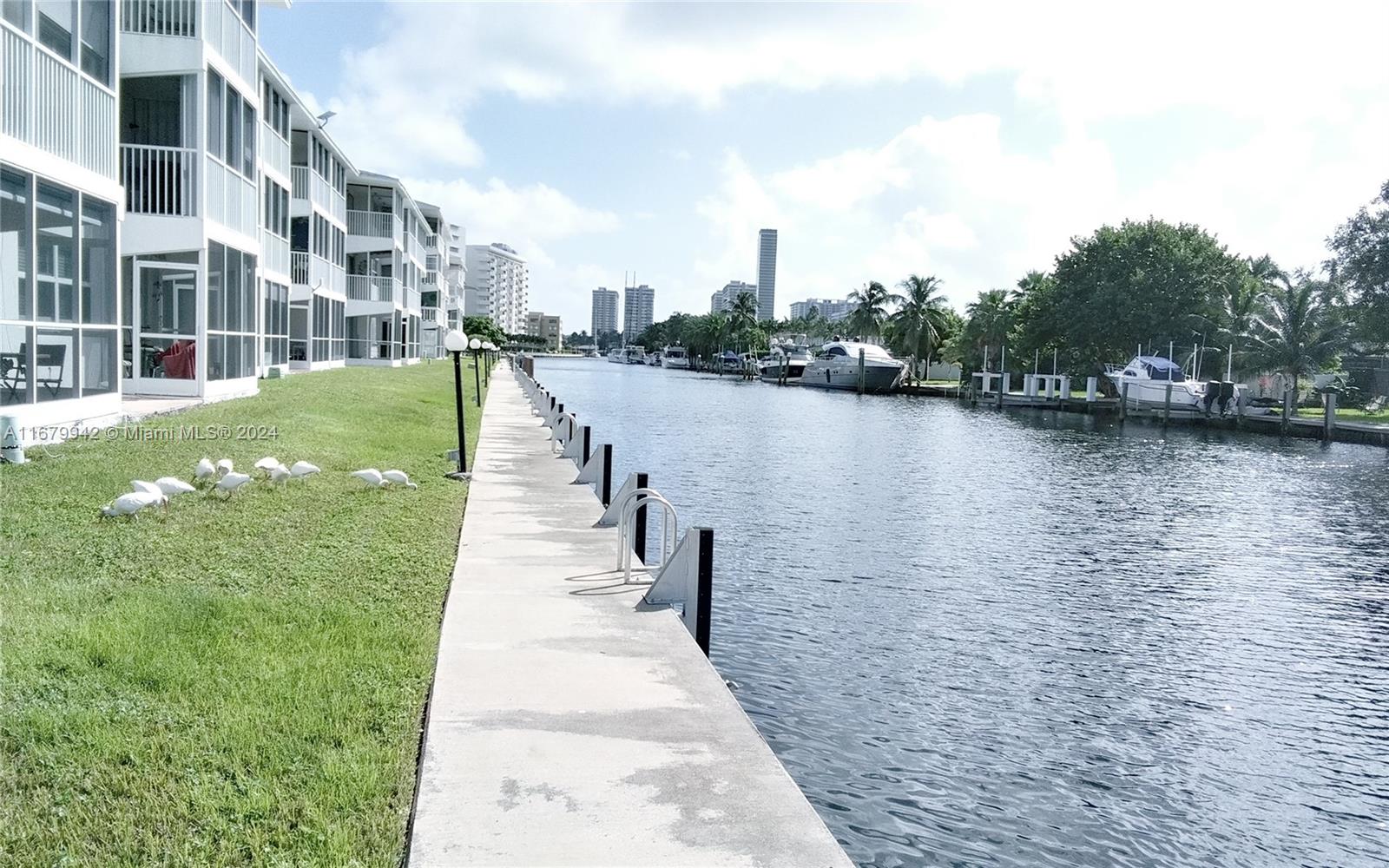 a view of a lake with a large building