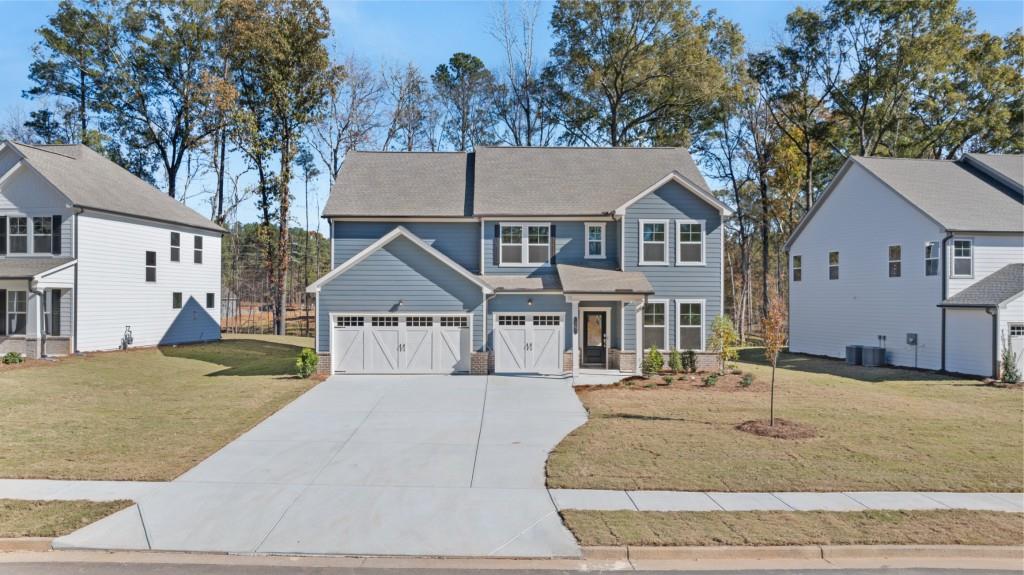 a front view of a house with a yard