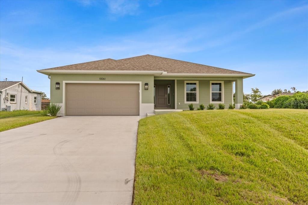 a view of a house with a yard