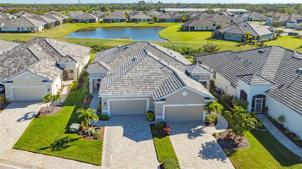 an aerial view of a house with a swimming pool yard and outdoor seating