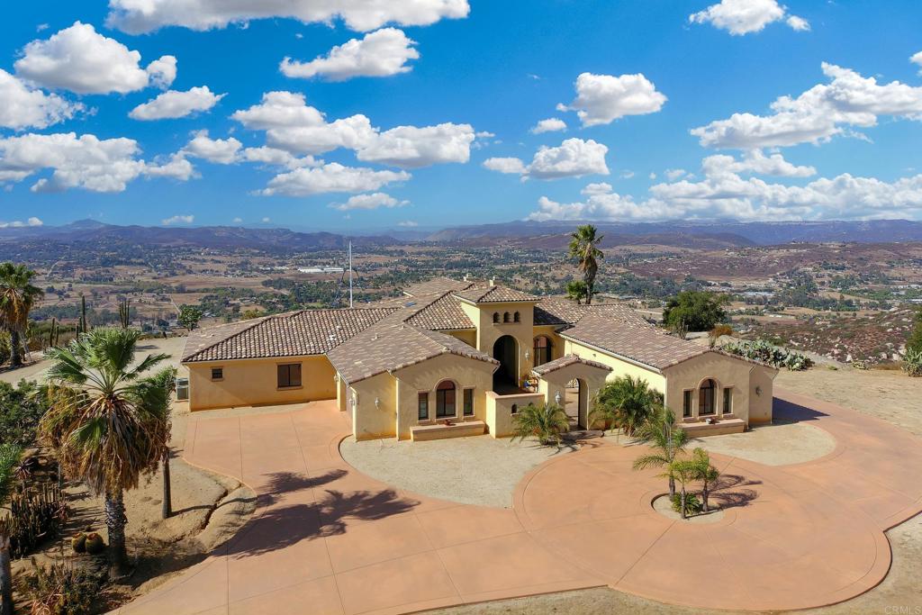 an aerial view of houses with yard