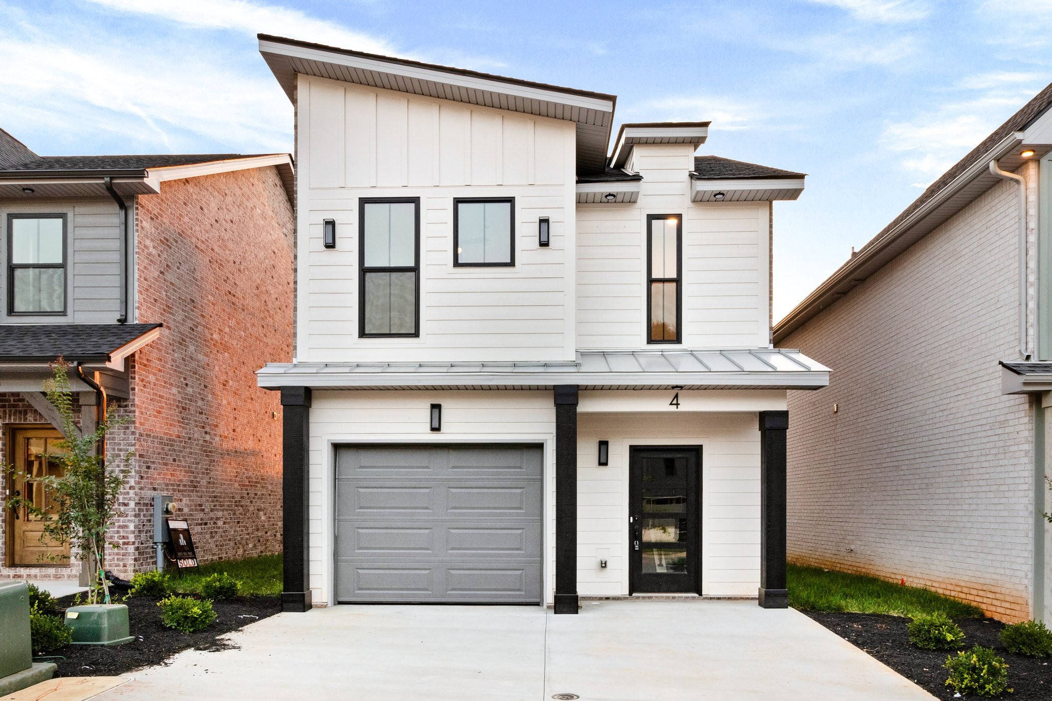 a front view of a house with garage