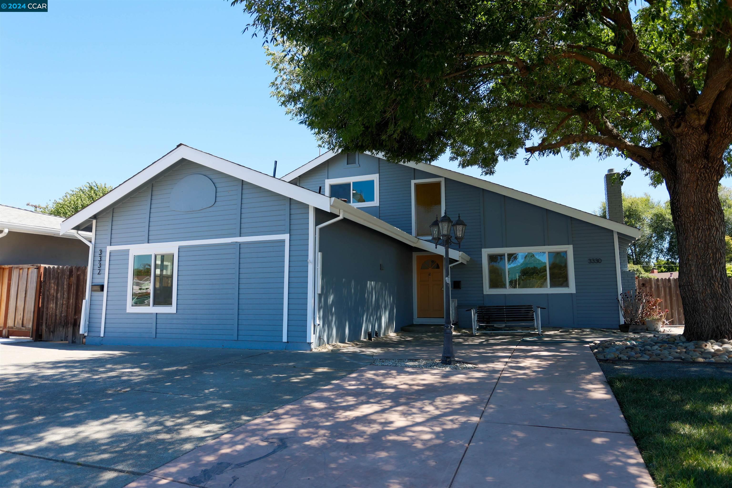 a front view of a house with yard