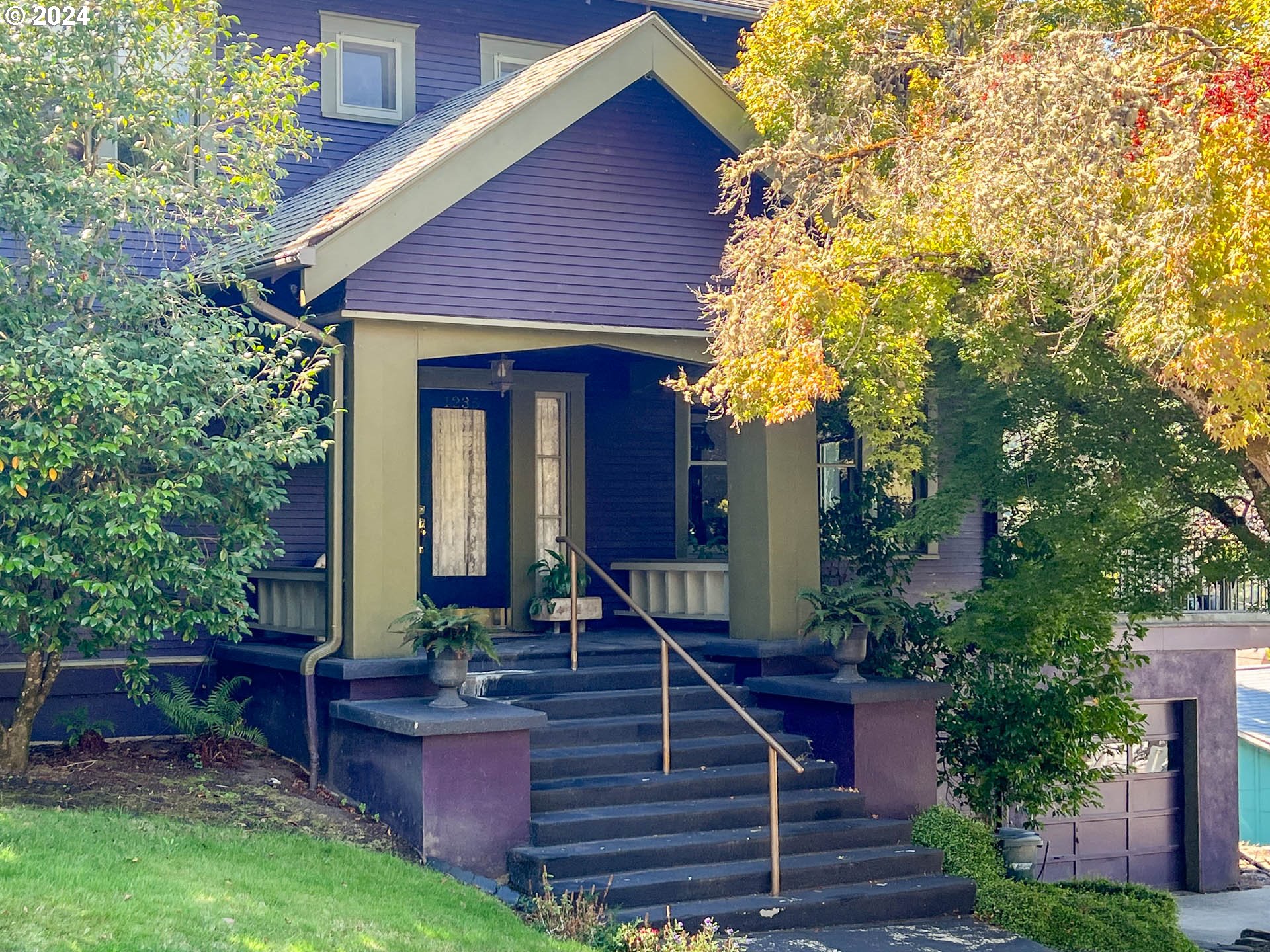 a front view of a house with garden