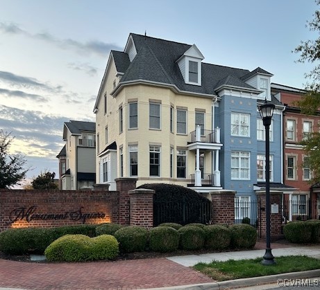 a front view of a residential apartment building with a yard