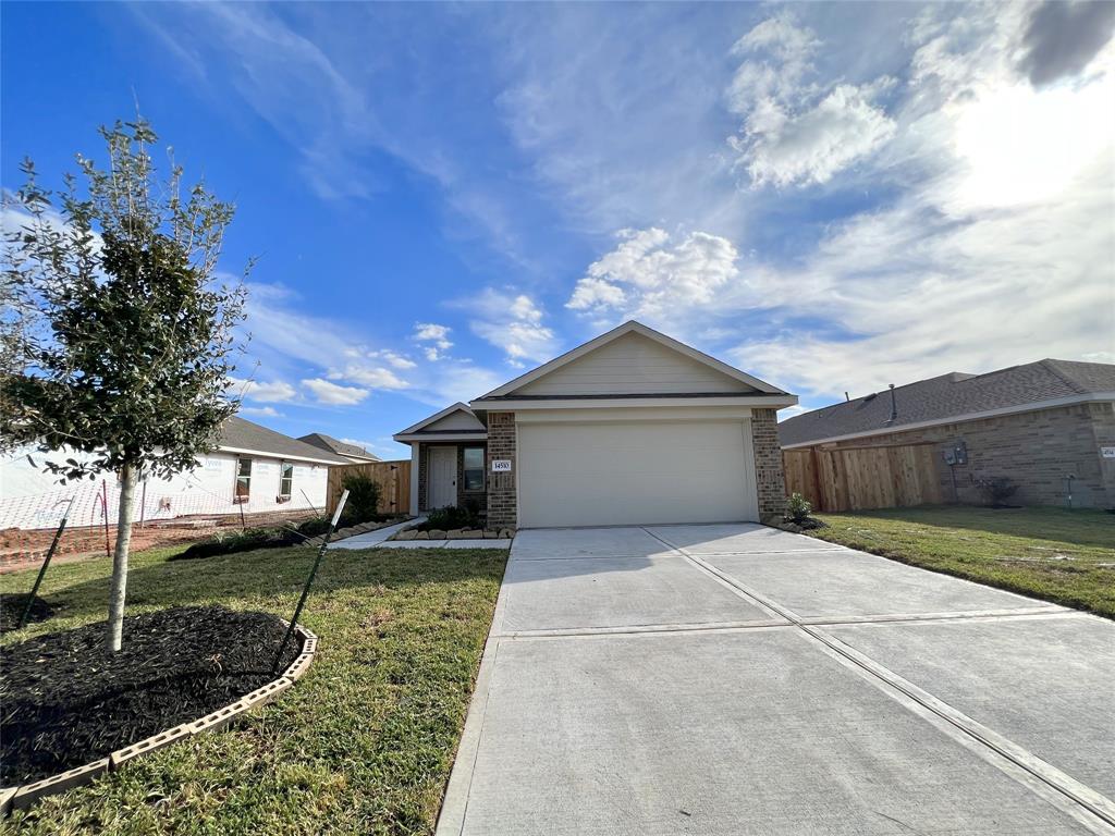 a front view of a house with yard