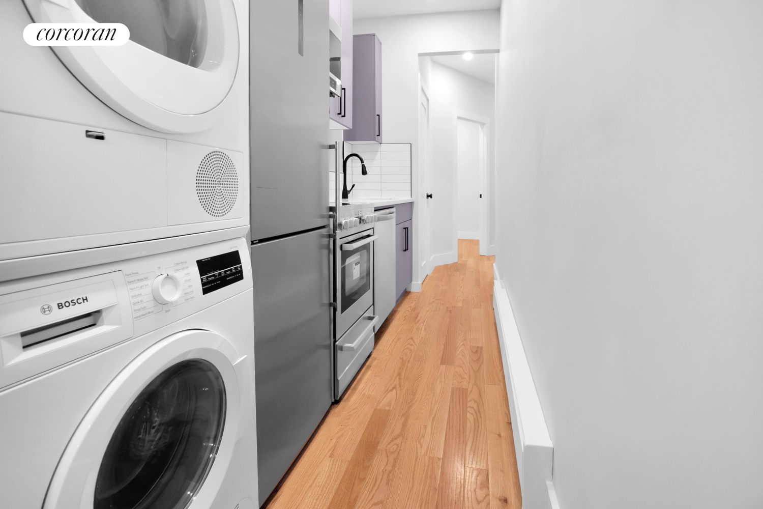 a view of a kitchen with washer and dryer