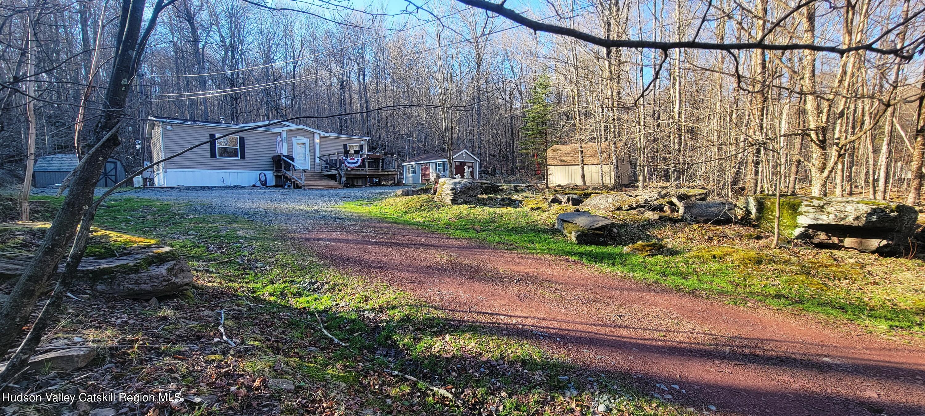 a view of backyard with wheel chair and potted plants