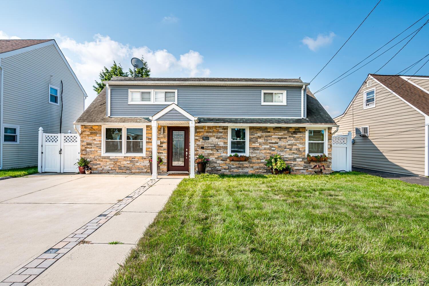 a front view of a house with yard