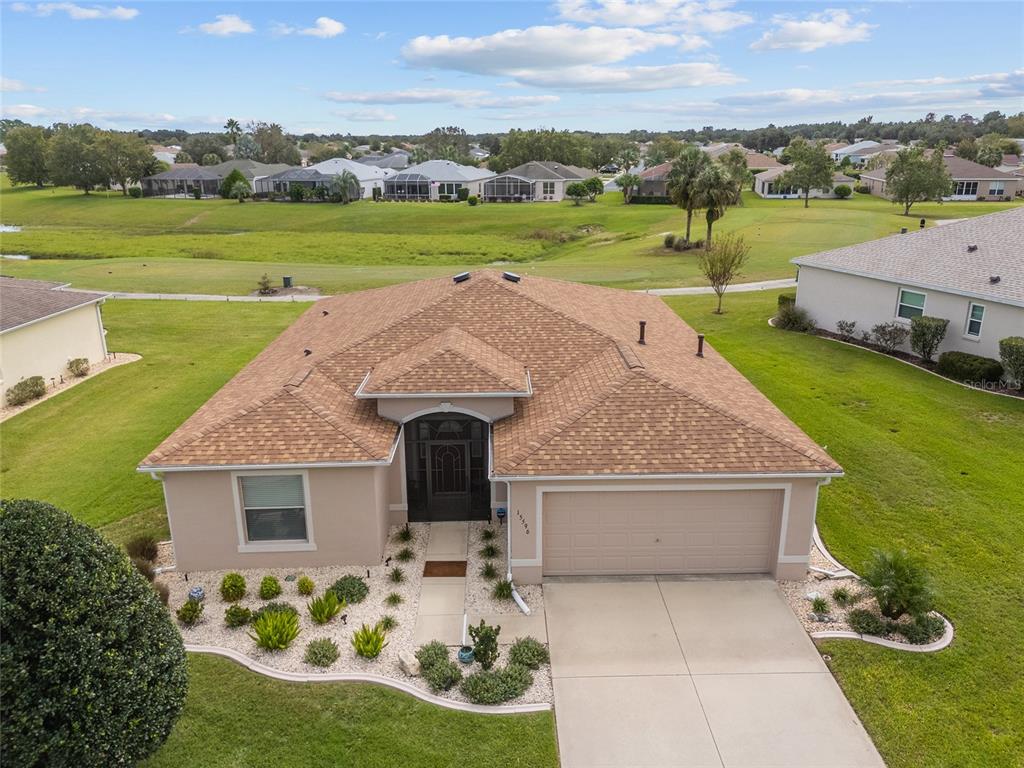 an aerial view of a house with garden