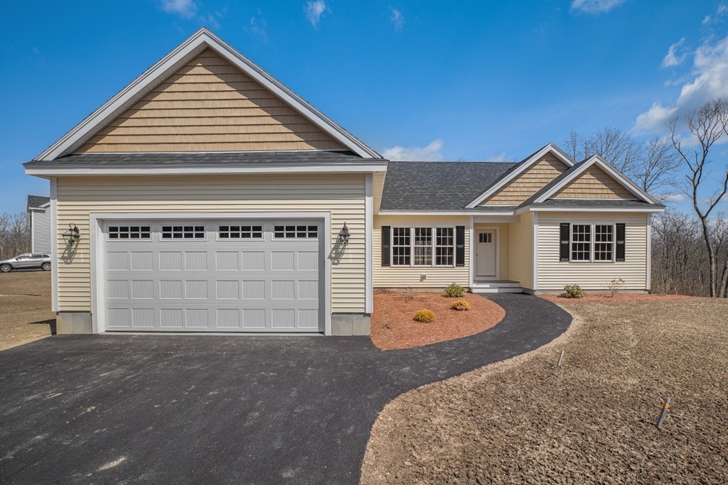 a front view of a house with yard