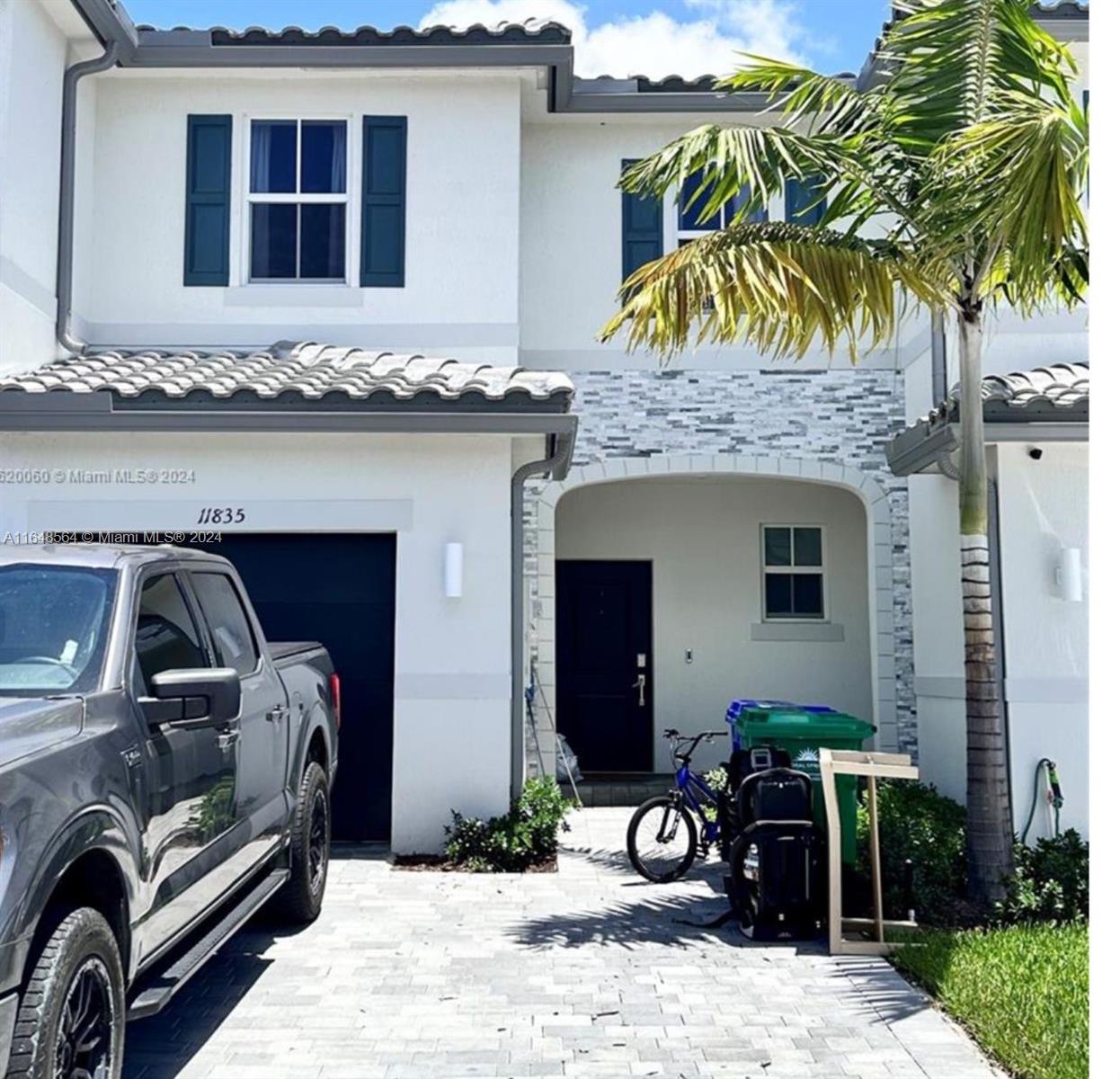 a front view of a house with parking space