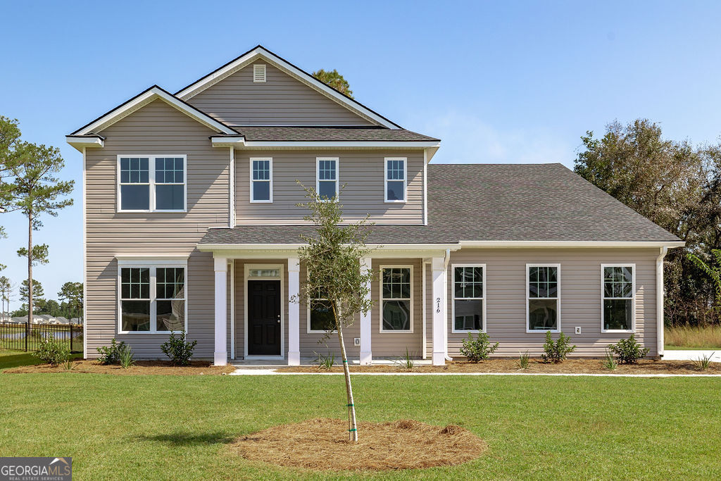 a front view of a house with a yard