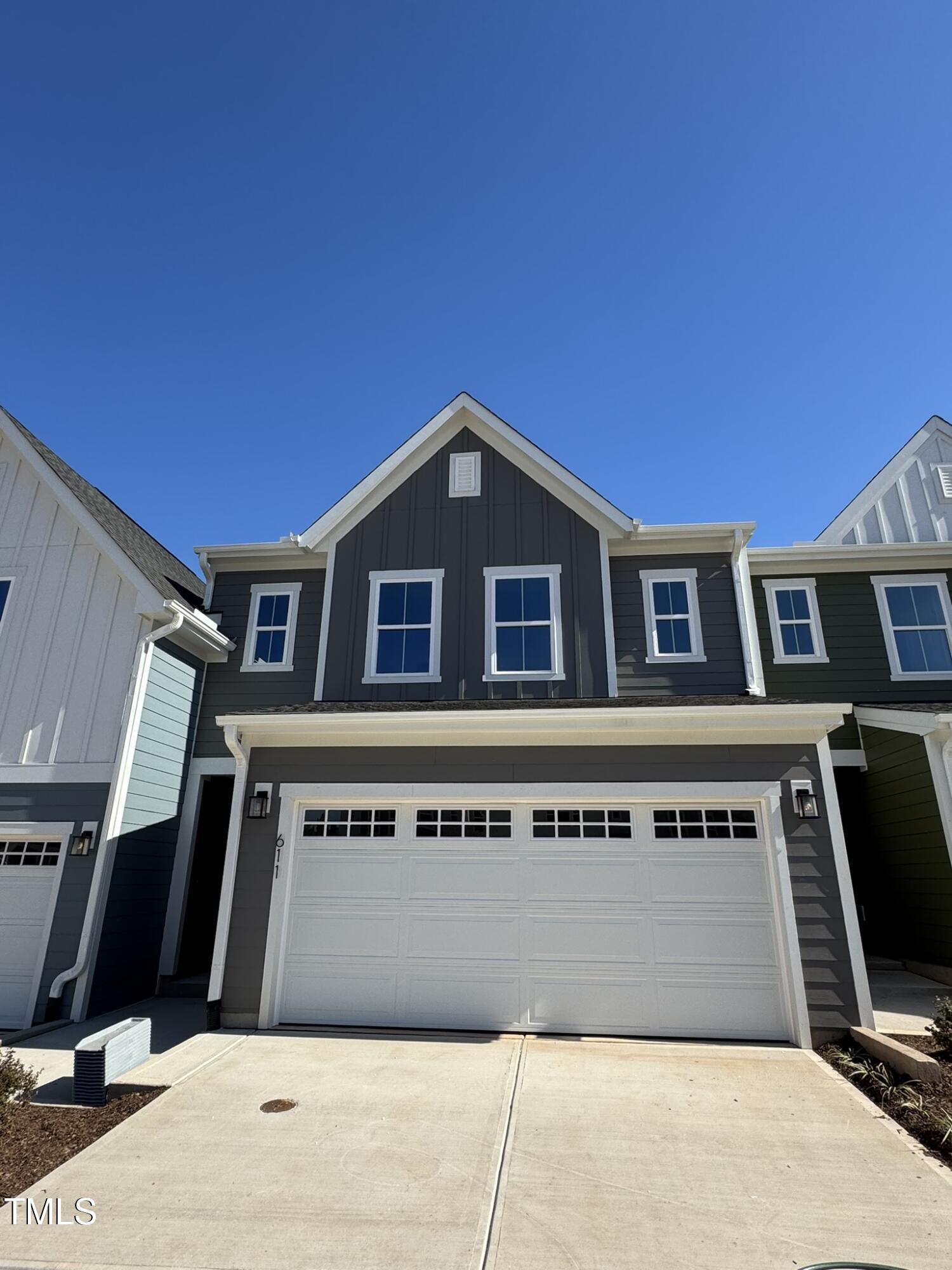 a front view of a house with garage